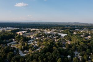 Aerial view of Austin suburban neighborhood in top-rated school district with tree-lined streets