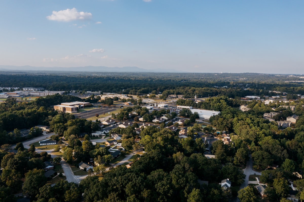 Aerial view of Austin suburban neighborhood in top-rated school district with tree-lined streets