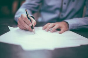 Person reviewing mortgage closing documents at a desk, representing the Texas closing disclosure process