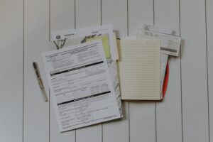 Stack of mortgage loan documents including Loan Estimate and Closing Disclosure forms for Austin Texas buyers