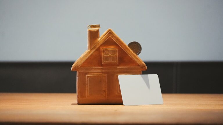 Small house with coins representing private mortgage insurance costs on a Texas mortgage