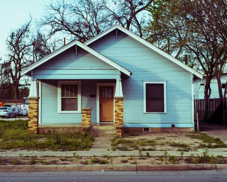 Blue single-family home in Austin Texas neighborhood