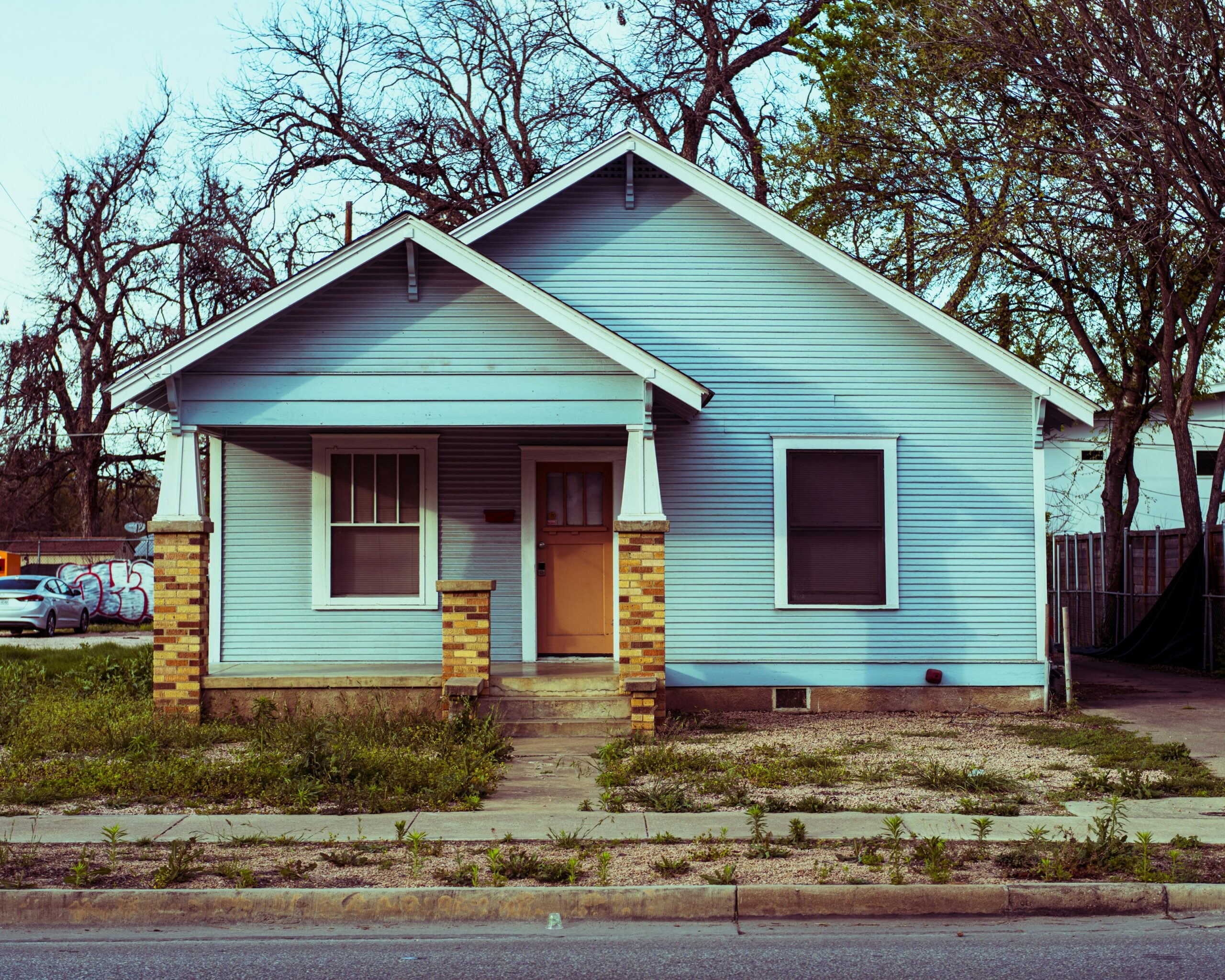 Blue single-family home in Austin Texas neighborhood