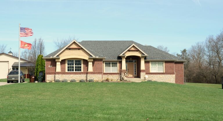 Modern brick house with green lawn representing VA loan home purchase opportunity in Texas