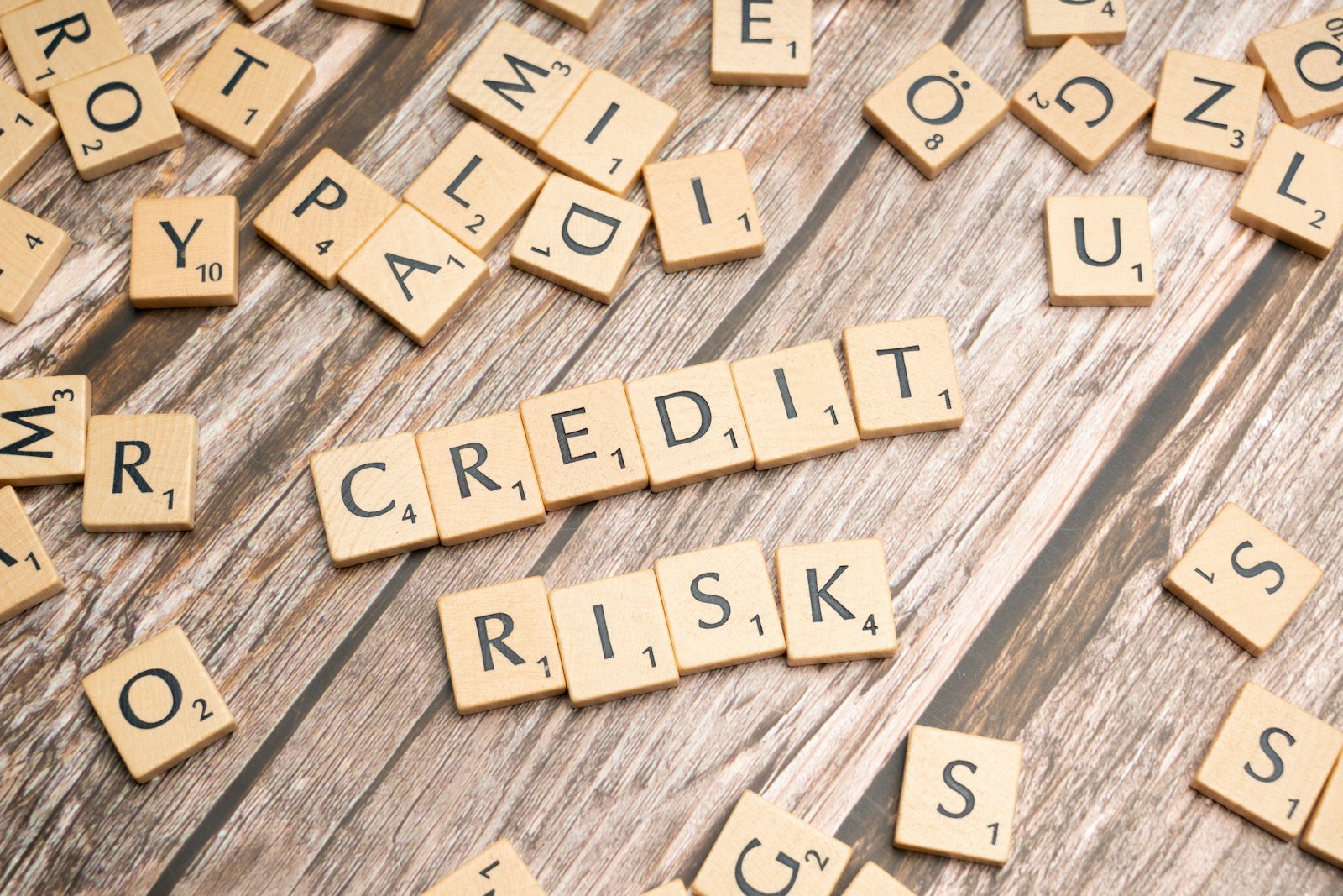 Tiles spelling credit and risk, illustrating how credit score affects an Austin mortgage rate
