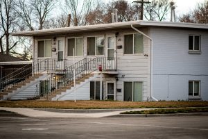 Small multi-unit rental building representing investment property financing in Austin