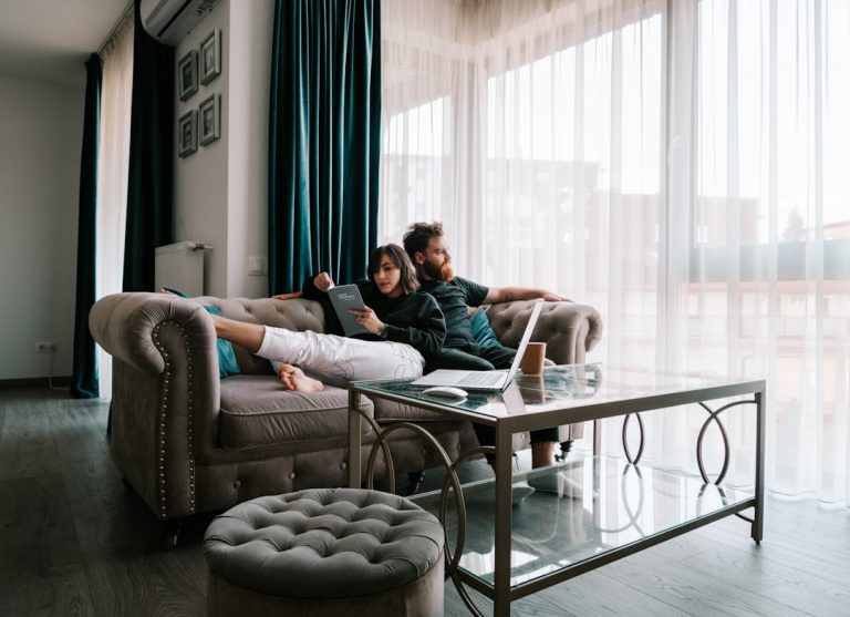 First-time homebuyers touring a house in Austin with their agent before making an offer