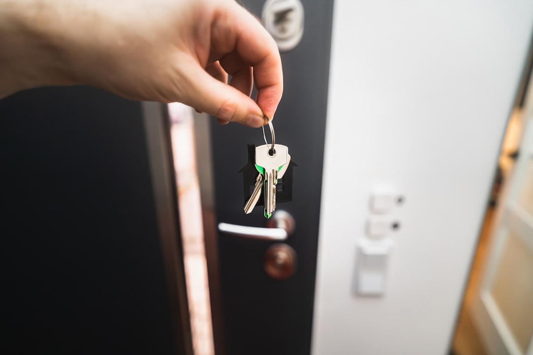 House keys on a table, representing one spouse keeping the home through a divorce home buyout in Austin