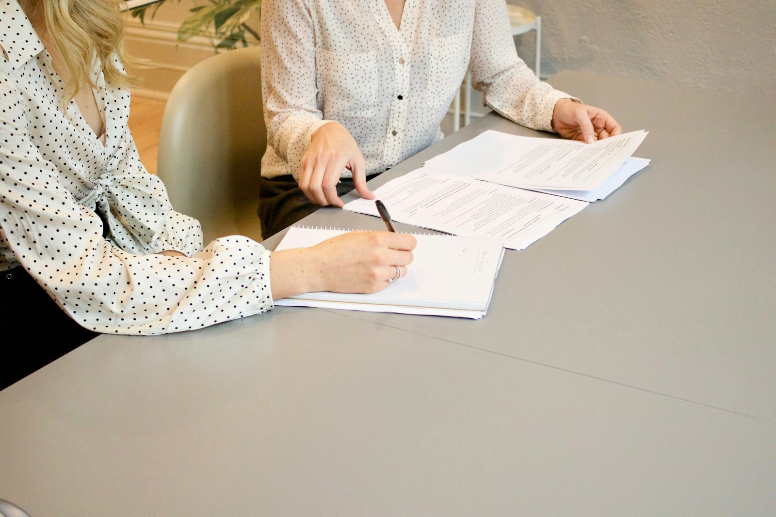 Austin homebuyer signing a written buyer representation agreement with a real estate agent