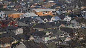 Dense neighborhood of small-lot starter homes on narrow lots in a new Texas subdivision