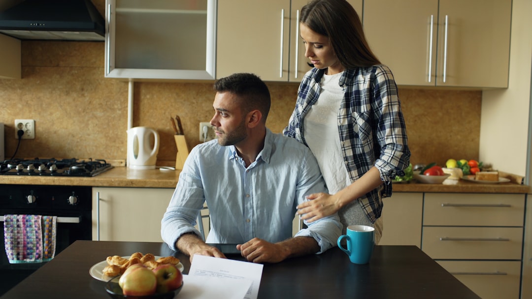 First-time buyers reviewing first year owning a home in Austin costs at their kitchen table
