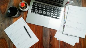 Wall calendar and mortgage documents on a desk, illustrating pre-approval document deadlines